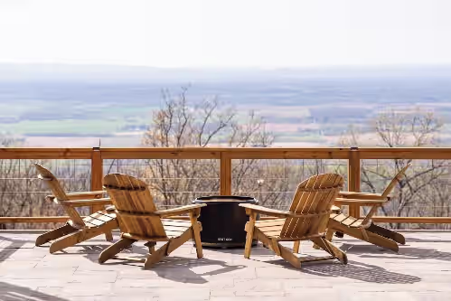 The fire pit and gorgeous background views overlooking the valley at Mountain Luxury