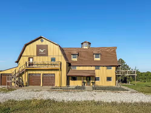 Front of "The Barn" at Spacious & Picturesque with Indoor Basketball/Pickleball Court, Hot Tub, Private Beach, Pond, & Fire
