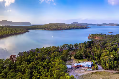 Bruny Island Lodge - Set amongst 860 acres of pristine bushland in remote South Bruny is The Lodge, a rustic timber chalet on the hill above Oyster Cove on Mickey’s Bay. The Lodge offers a unique experience on Bruny Island; it combines spectacular n